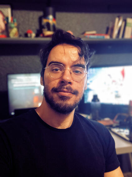 A picture of Gonçalo Rocha Santos sat at his desk.